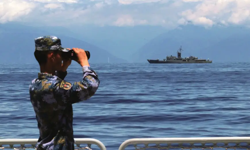 A PLA soldier looks around with a telescope on August 5, 2022, as the Navy of the PLA Eastern Theater Command continues drills the waters around the island of Taiwan. Photo: Xinhua