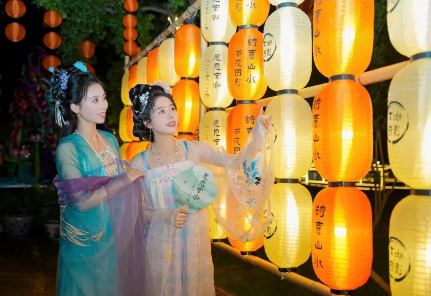 Tourists visit a lantern fair in a wetland park in Changxing county, Huzhou, east China's Zhejiang province, August 2, 2024. (Photo by Chen Haiwei/People's Daily Online)