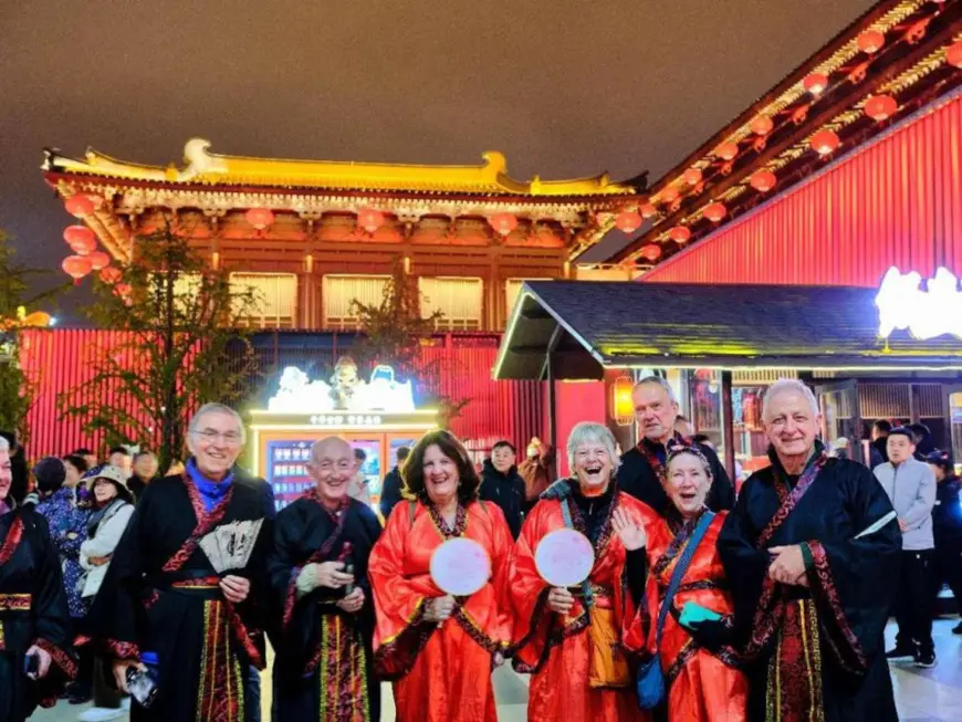 Tourists from the United Kingdom and Australia pose for a picture at the Tang Paradise, a large cultural theme park showing the lifestyle of the prosperous Tang Dynasty (618-907) in Xi'an, northwest China's Shaanxi province, October 20, 2024. (Photo by Shi Jiamin/People's Daily Online)