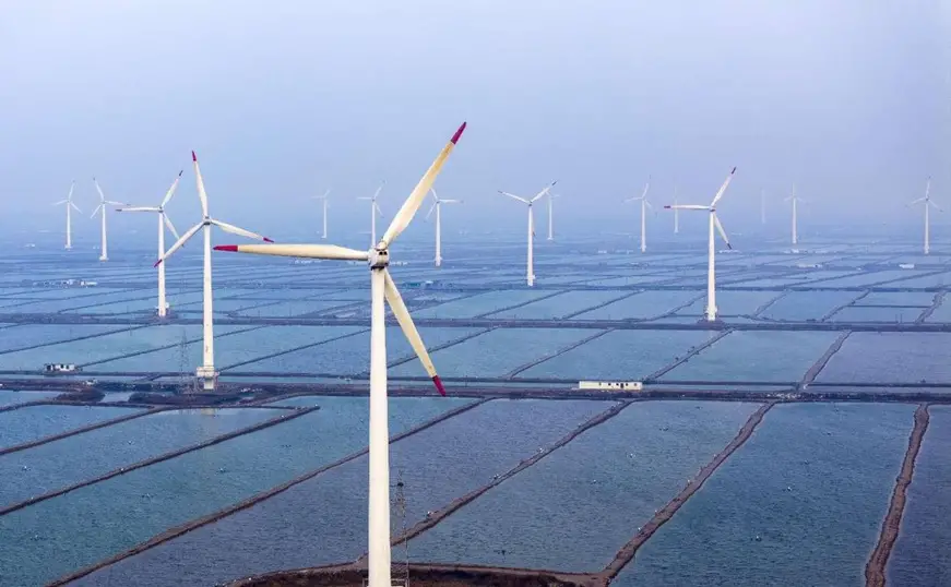 Photo shows wind turbines on a mudflat in Yancheng, east China's Jiangsu province. (Photo by Ji Haixin/People's Daily Online)