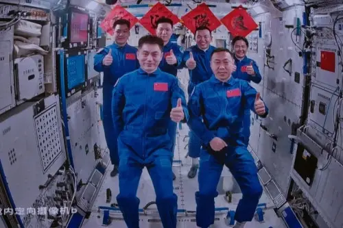 The crew of Shenzhou-18 and Shenzhou-19 manned spaceships pose for a photo in China's space station, Oct. 30. (Photo by Li Jie)