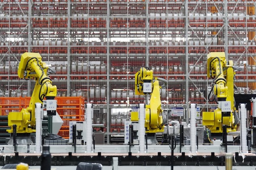 This photo taken on Feb. 26, 2025 shows smart equipment running at a coil factory in Harbin Electric Machinery Company Ltd. in Harbin, northeast China's Heilongjiang Province. (Xinhua/Wang Song)