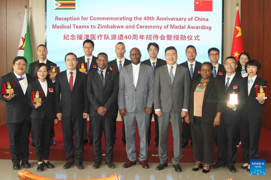 Members of the Chinese medical team pose for a group photo with Chinese and Zimbabwean officials at the Chinese embassy in Harare, Zimbabwe, on March 6, 2025. (Xinhua/Tafara Mugwara)