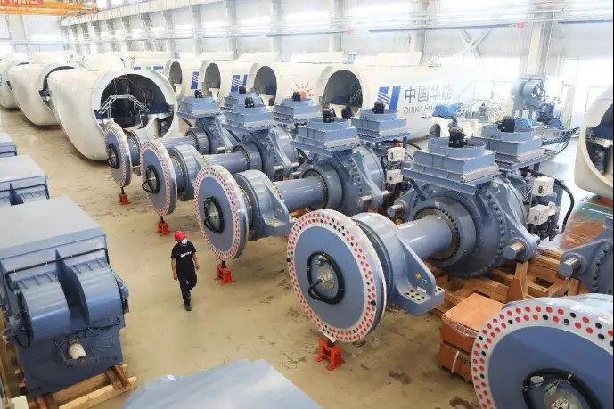 A worker walks in a workshop of a wind power equipment manufacturer in Zhangbei county, north China's Hebei province. (Photo by Wu Diansen/People's Daily Online)