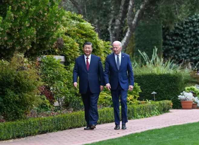 Chinese President Xi Jinping and U.S. President Joe Biden take a walk after their talks in the Filoli Estate in the U.S. state of California, Nov. 15, 2023. (Photo by Rao Aimin/Xinhua)