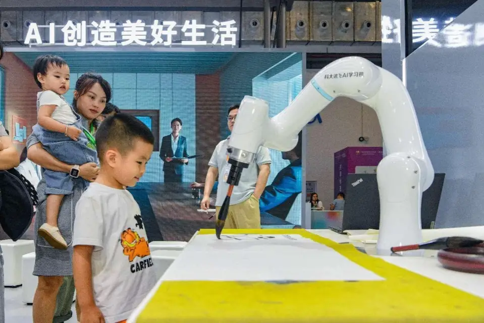 An artificial intelligence-enabled robotic arm writes Chinese calligraphy at the fourth China International Consumer Products Expo (CICPE) held in Haikou, south China's Hainan province, April 2024. (Photo by Yang He/People's Daily Online)