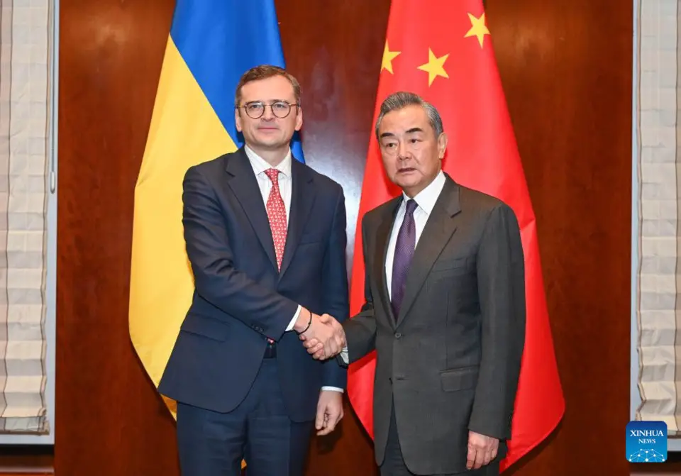 Chinese Foreign Minister Wang Yi, also a member of the Political Bureau of the Communist Party of China Central Committee, meets with Ukrainian Foreign Minister Dmytro Kuleba on the sidelines of the Munich Security Conference in Munich, Germany, Feb. 17, 2024. (Xinhua/Ren Pengfei)