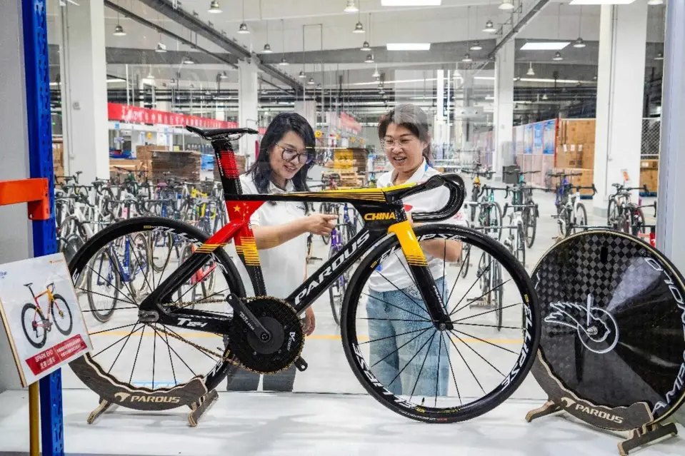 A sample of a bicycle to compete in the Paris Olympics is exhibited in a workshop of Shandong Taishan Ruibao Composite Material Co., Ltd. in east China's Shandong province, July 8, 2024. (Photo by Jia Peng/People's Daily Online)