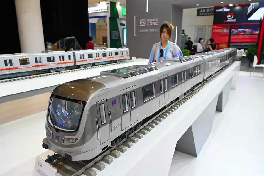 A visitor views a model of Xiamen Metro train at the exhibition of BRICS New Industrial Revolution 2024 in Xiamen, southeast China's Fujian Province, Sept. 10, 2024. (Xinhua/Lin Shanchuan)